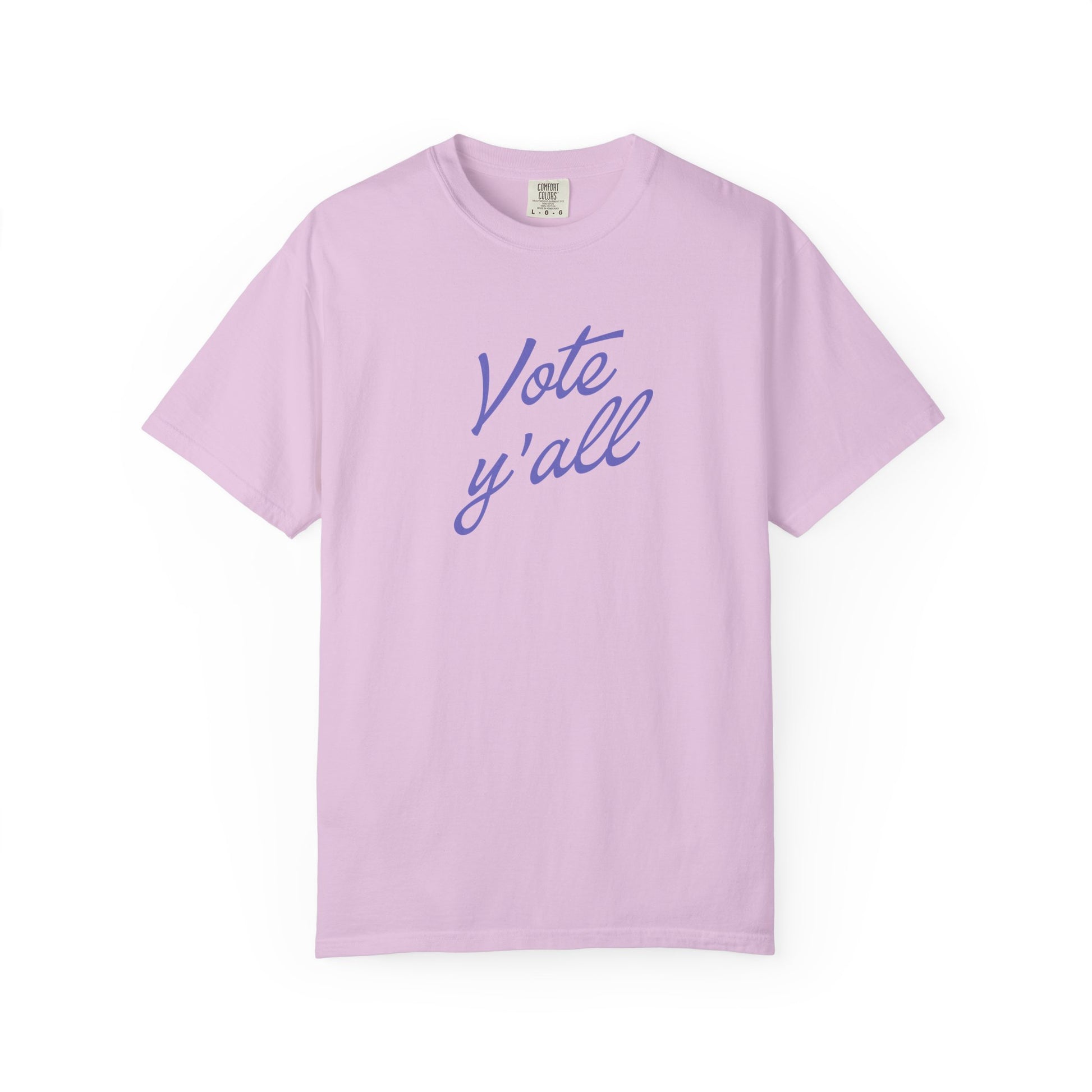 A short-sleeve crewneck t-shirt in a light purple color, featuring the phrase 'Vote y'all' printed in purple cursive script across the chest, displayed on a clean white background.