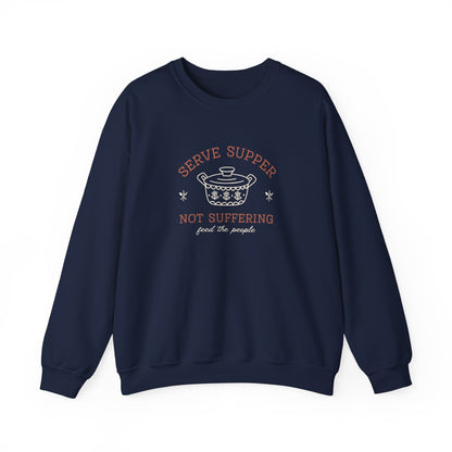Navy blue sweatshirt with a white vintage Pyrex illustration and dark orange and white text "serve supper, not suffering, feed the people"