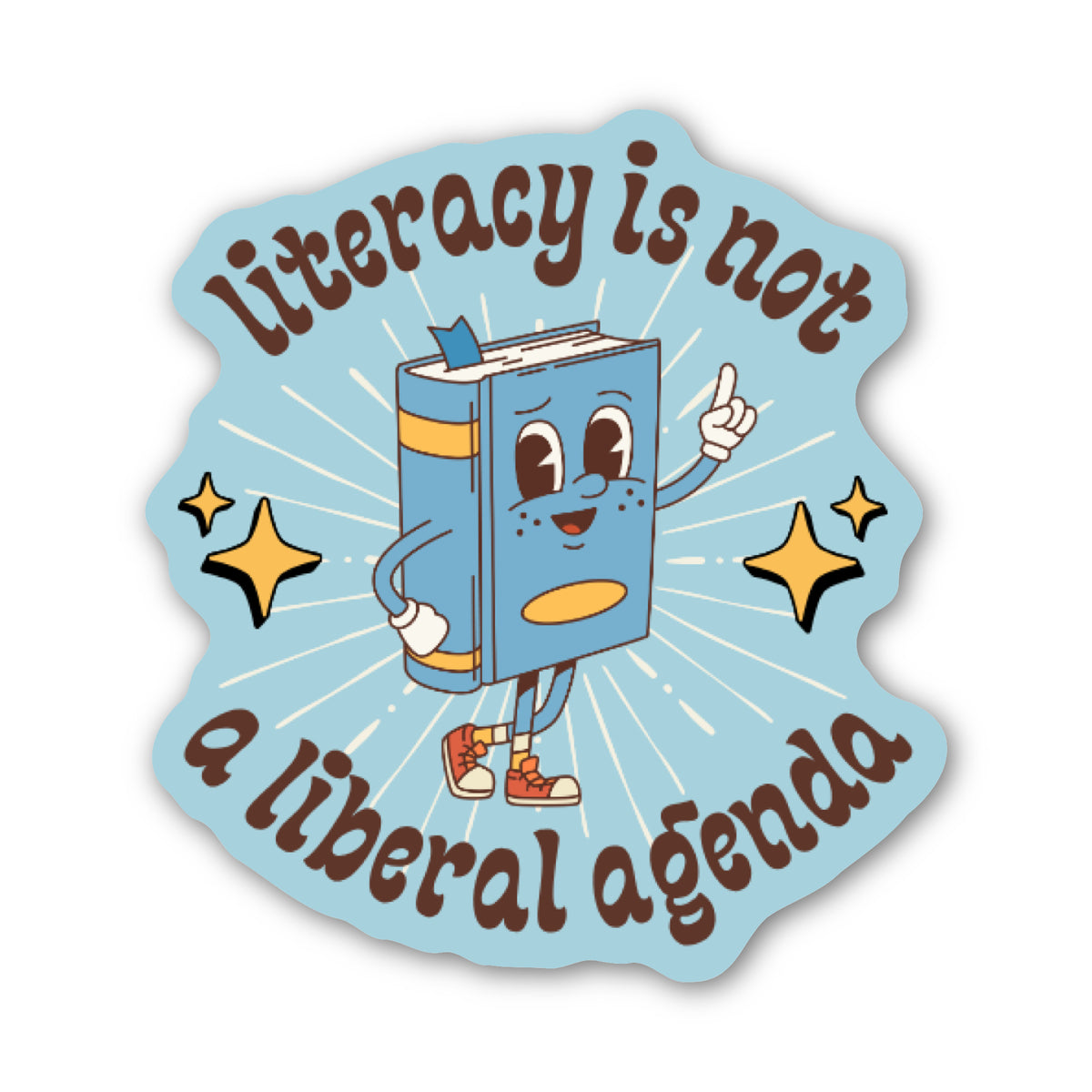 A die-cut sticker featuring a light blue background with the text 'literacy is not a liberal agenda' in brown retro lettering. In the center is a cartoon blue book character with arms, legs, and orange sneakers, surrounded by yellow star accents and white sunburst lines.
